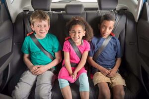 Is it legal for children to ride in a taxi without a child seat?